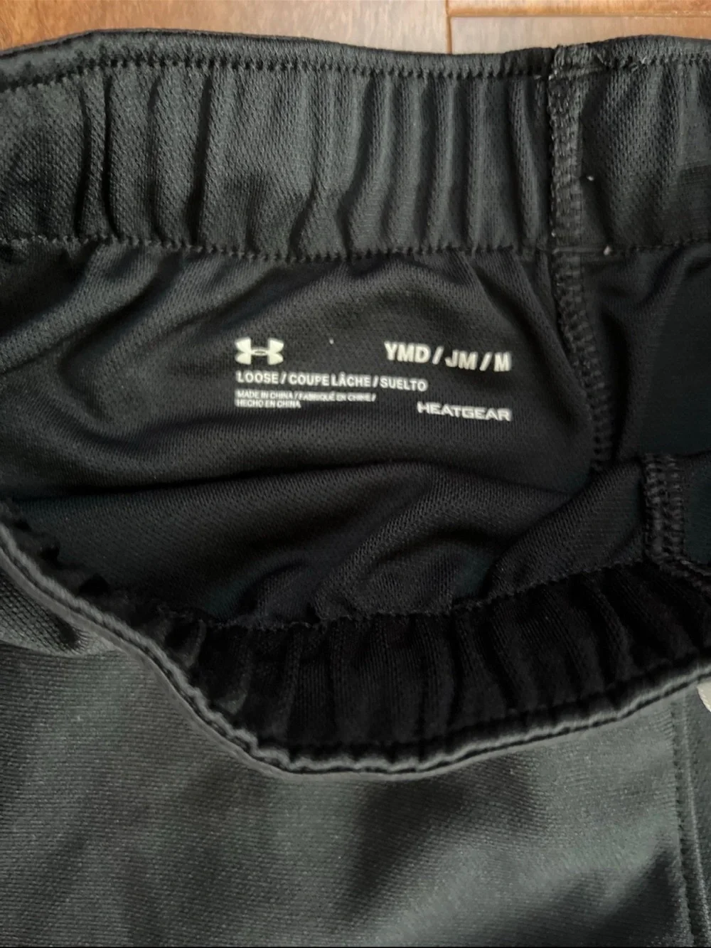 Under Armour Black Athletic Shorts with White Trim and Branded Waistband